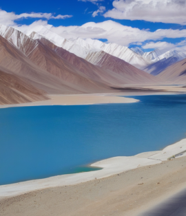 Majestic landscape of Leh Ladakh featuring snow-capped mountains, a serene lake, and a winding road.