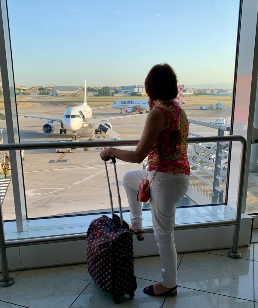 Modern airport view with planes on the runway and a vibrant terminal atmosphere.